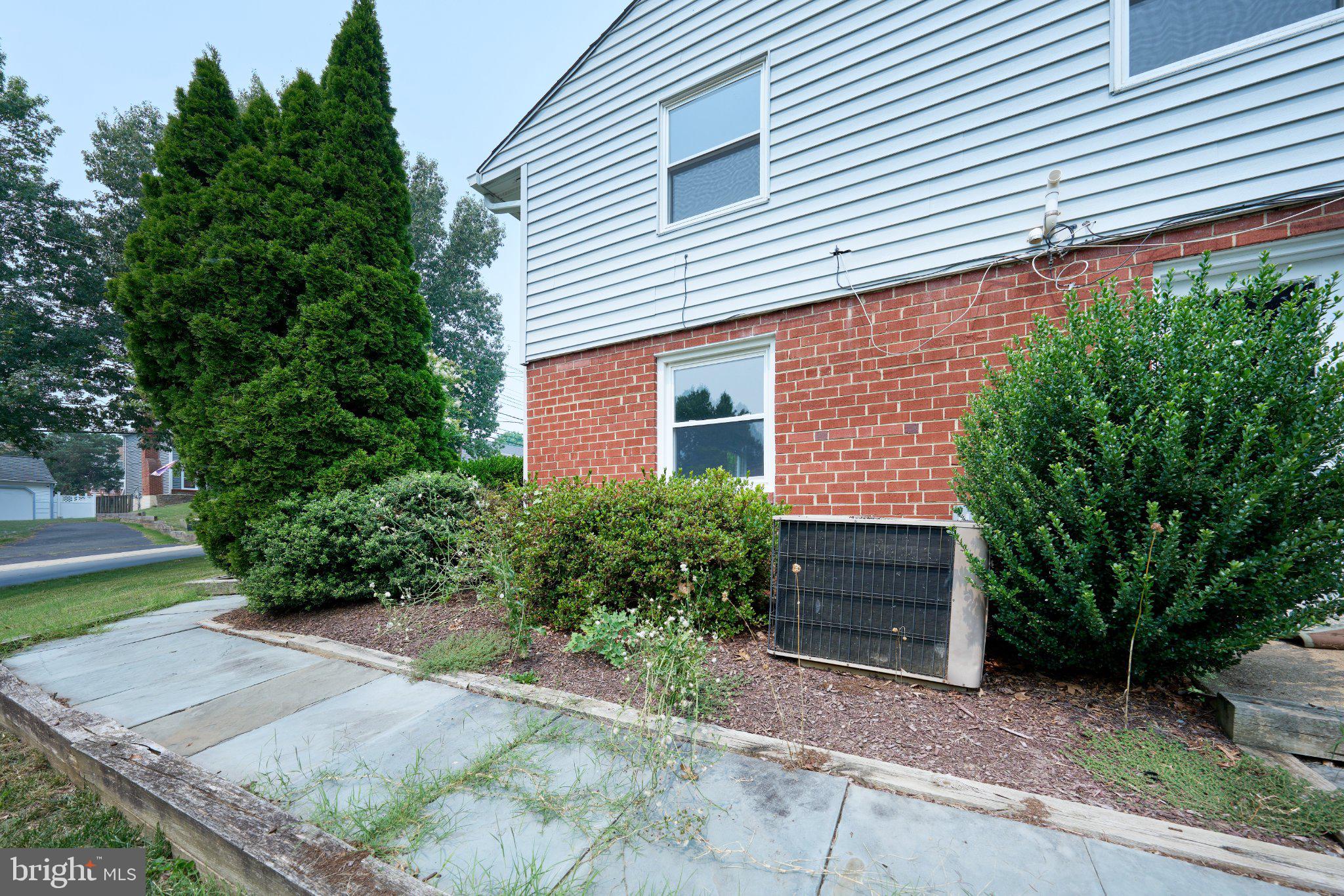 2924 Gracefield Road Silver Spring, MD 20904 - Photo 43 of 57 Charming brick exterior with lush greenery.