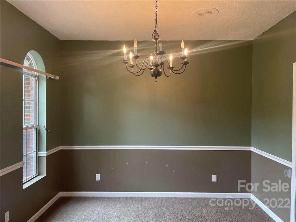 1014 Briarcliff Road Mooresville, NC 28115 - Photo 11 of 27 a view of a room with a ceiling fan and a window