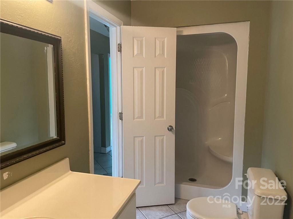 1014 Briarcliff Road Mooresville, NC 28115 - Photo 17 of 27 a bathroom with a sink and a mirror