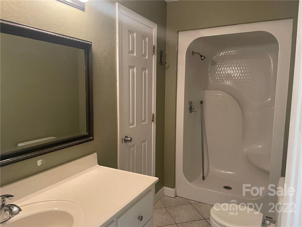 1014 Briarcliff Road Mooresville, NC 28115 - Photo 20 of 27 a bathroom with a sink a toilet and shower