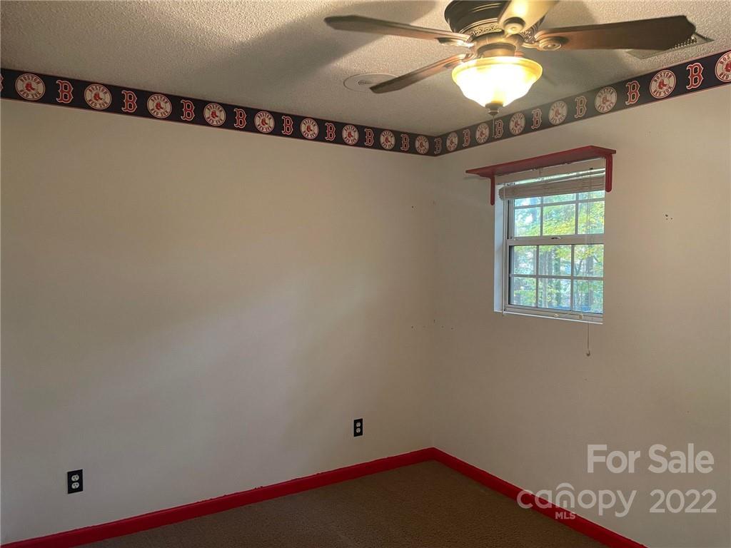 1014 Briarcliff Road Mooresville, NC 28115 - Photo 23 of 27 a view of a room with window and a ceiling fan
