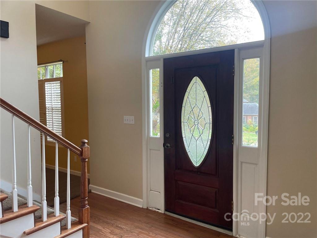 1014 Briarcliff Road Mooresville, NC 28115 - Photo 4 of 27 a clock on a wall next to a window