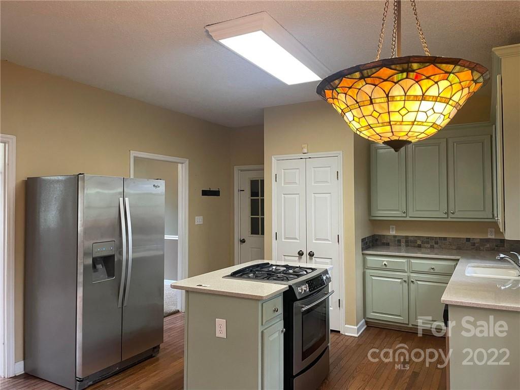 1014 Briarcliff Road Mooresville, NC 28115 - Photo 7 of 27 a kitchen with a stove and refrigerator