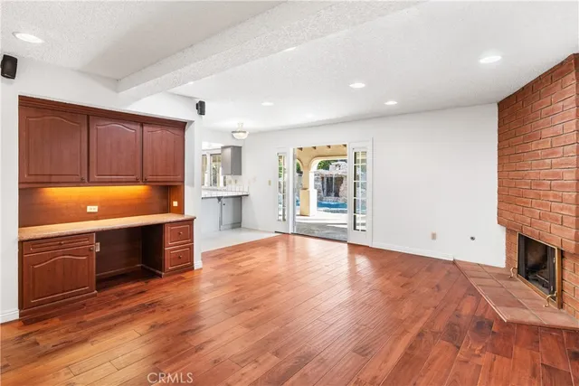 a view of kitchen with microwave and cabinets