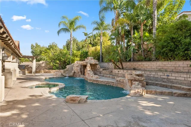 a view of a backyard with swimming pool