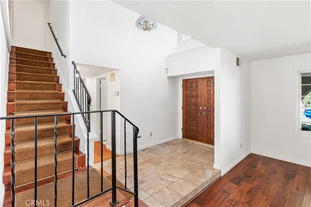 a view of entryway with wooden floor
