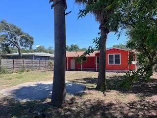 a view of a yard with a tree