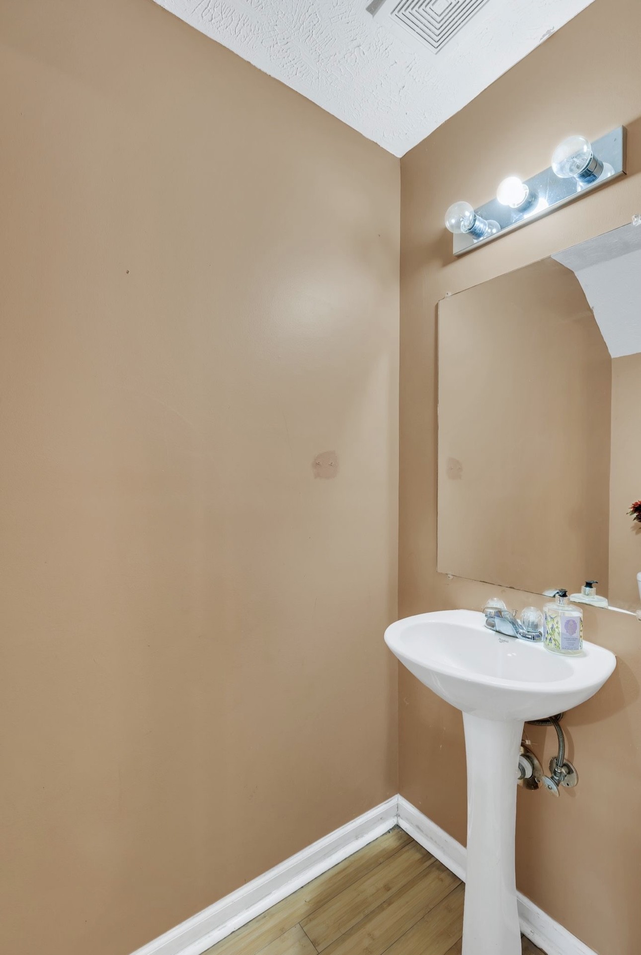 Undisclosed Address Antioch, TN 37013 - Photo 11 of 18 a bathroom with a sink and a mirror