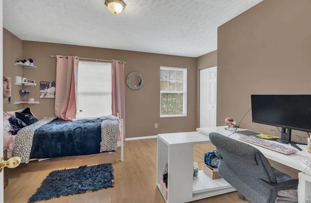 Undisclosed Address Antioch, TN 37013 - Photo 14 of 18 a bedroom with a bed and a window