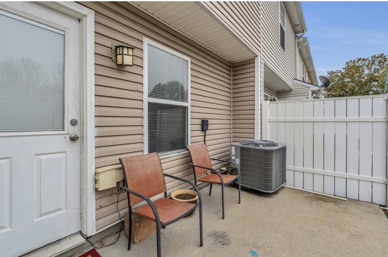 Undisclosed Address Antioch, TN 37013 - Photo 16 of 18 a view of backyard with a chair and potted plants