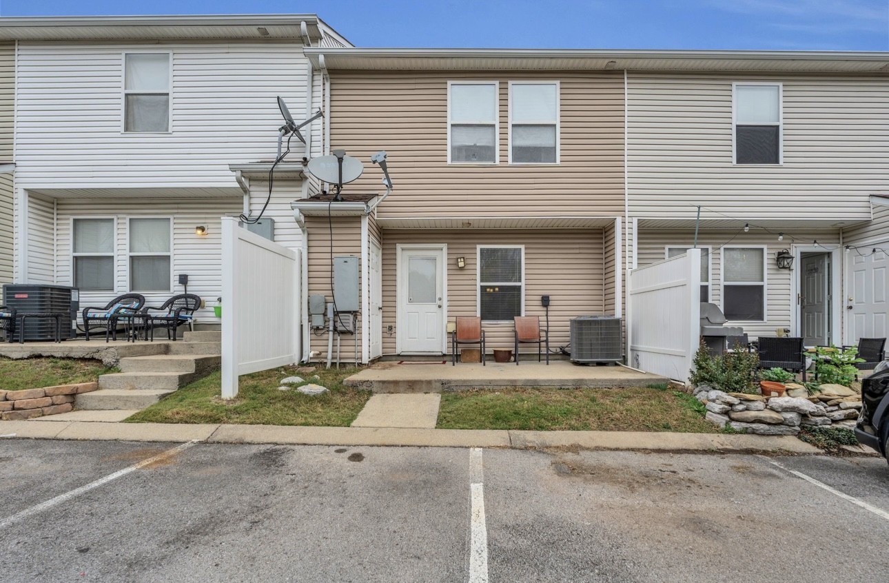 Undisclosed Address Antioch, TN 37013 - Photo 17 of 18 a front view of a house with a yard and garage