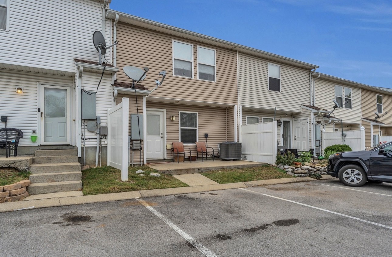Undisclosed Address Antioch, TN 37013 - Photo 18 of 18 a car parked in front of a white house