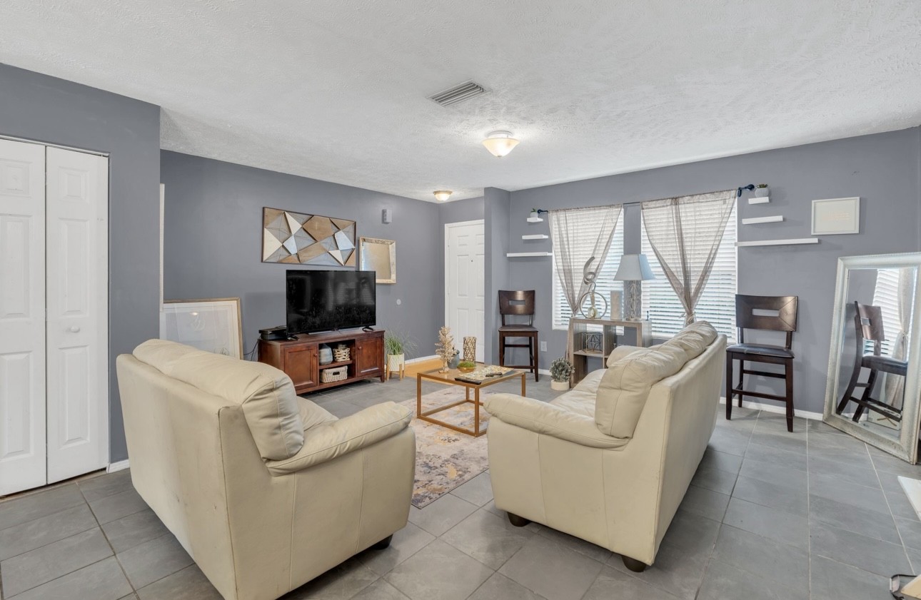 Undisclosed Address Antioch, TN 37013 - Photo 6 of 18 a living room with furniture and a flat screen tv