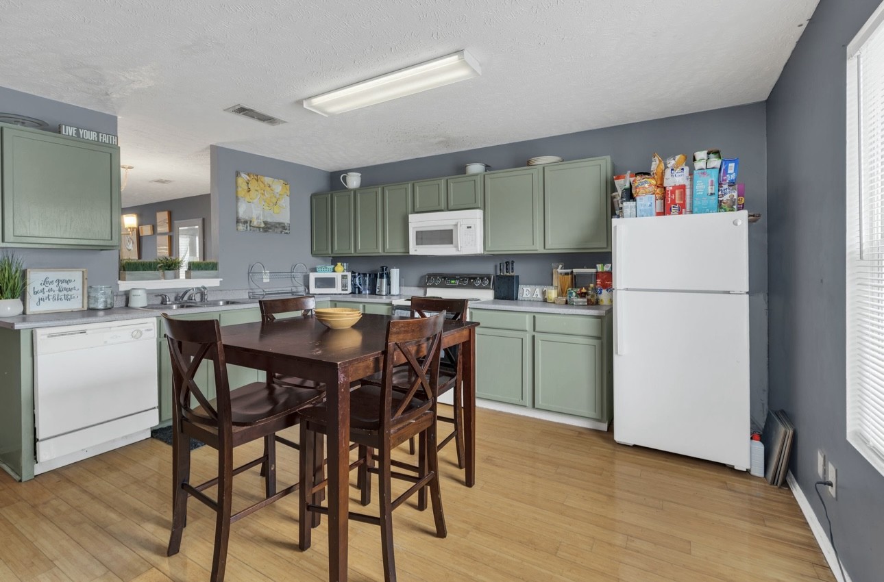 Undisclosed Address Antioch, TN 37013 - Photo 9 of 18 a kitchen with refrigerator and cabinets
