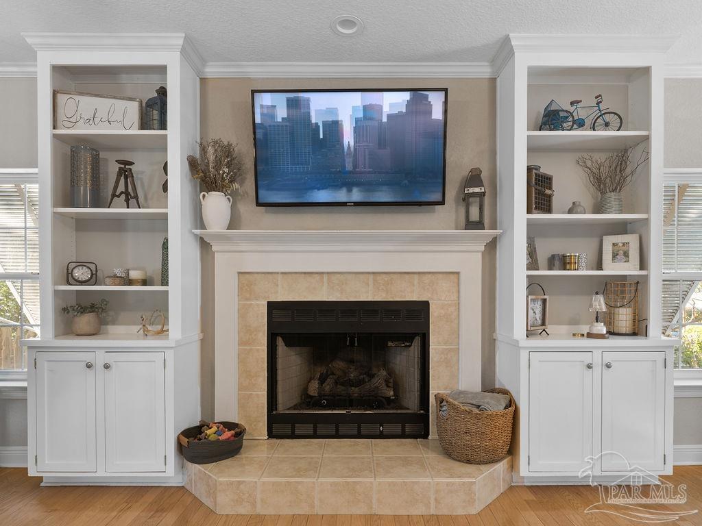 10152 Bittern Drive Pensacola, FL 32507 - Photo 11 of 45 a living room with furniture and a fireplace