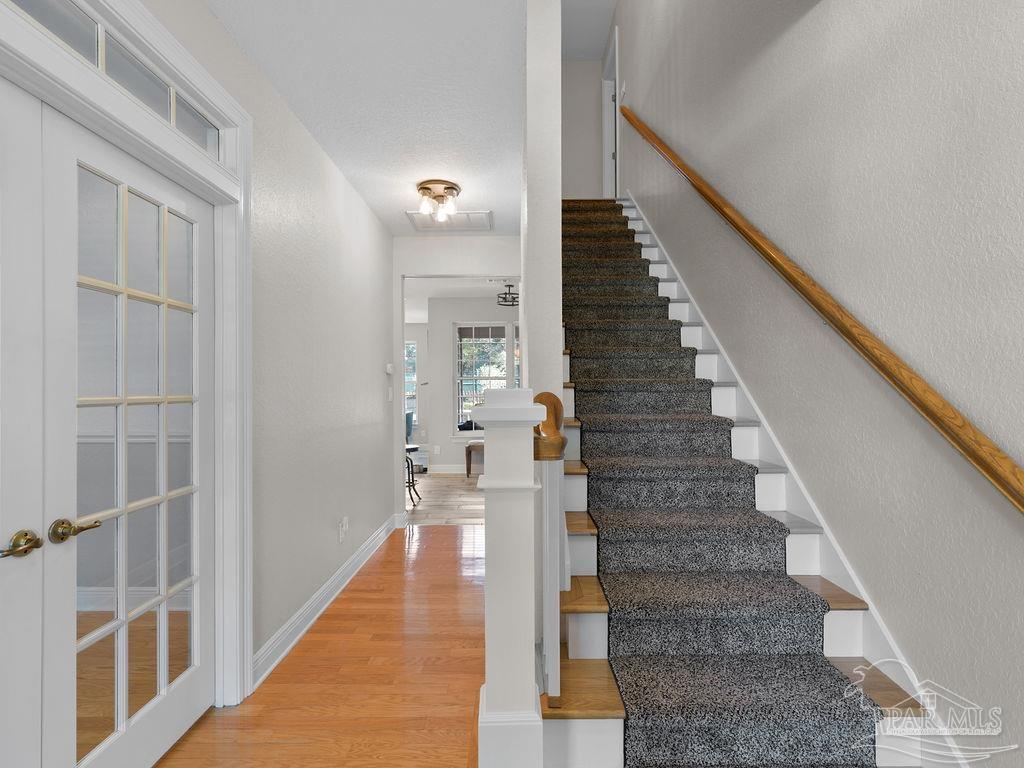 10152 Bittern Drive Pensacola, FL 32507 - Photo 12 of 45 a view of staircase with white walls