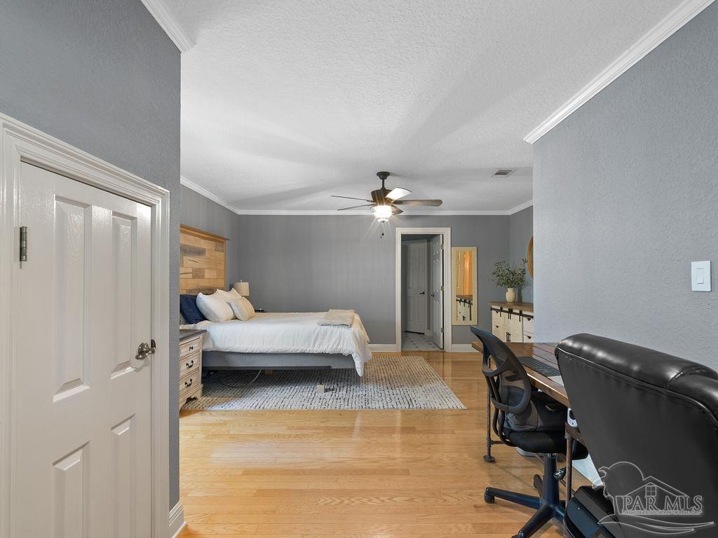 10152 Bittern Drive Pensacola, FL 32507 - Photo 18 of 45 a living room with furniture and a chandelier