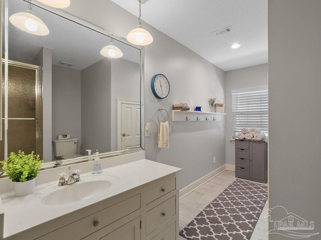 10152 Bittern Drive Pensacola, FL 32507 - Photo 23 of 45 a bathroom with a sink and a mirror