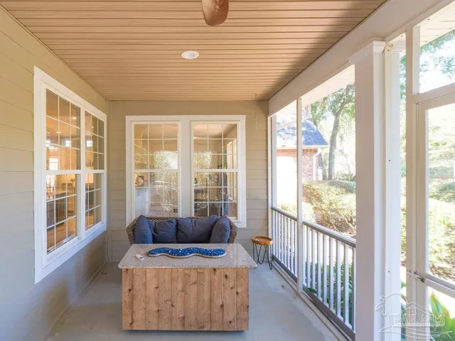 a balcony with furniture and outdoor view