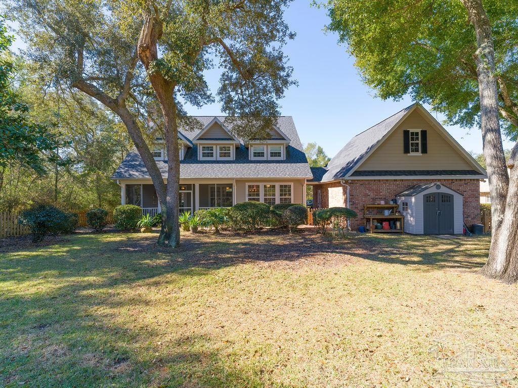 10152 Bittern Drive Pensacola, FL 32507 - Photo 32 of 45 a front view of a house with a yard