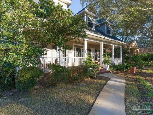 a view of a golf course with trees