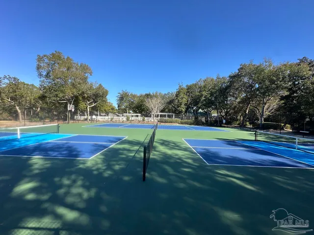 a view of outdoor space and tennis court