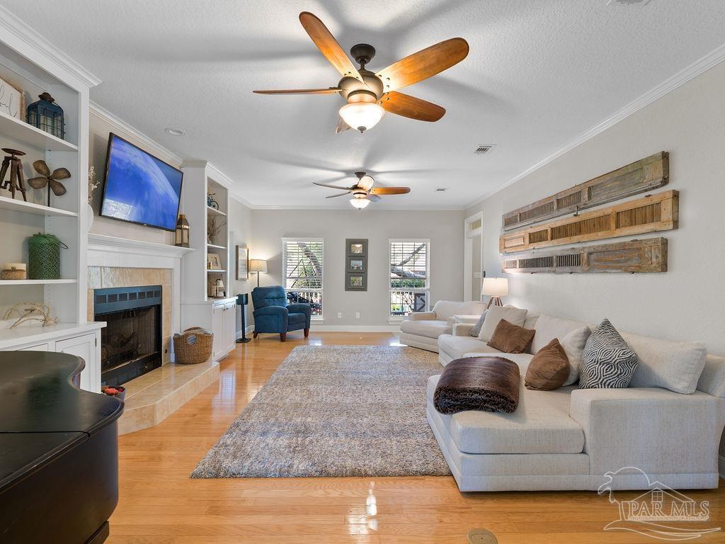 10152 Bittern Drive Pensacola, FL 32507 - Photo 4 of 45 a living room with furniture and a fireplace