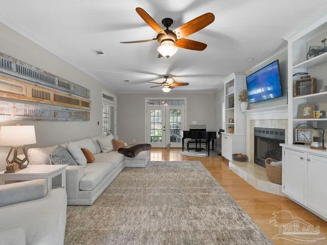 a living room with furniture and a fireplace