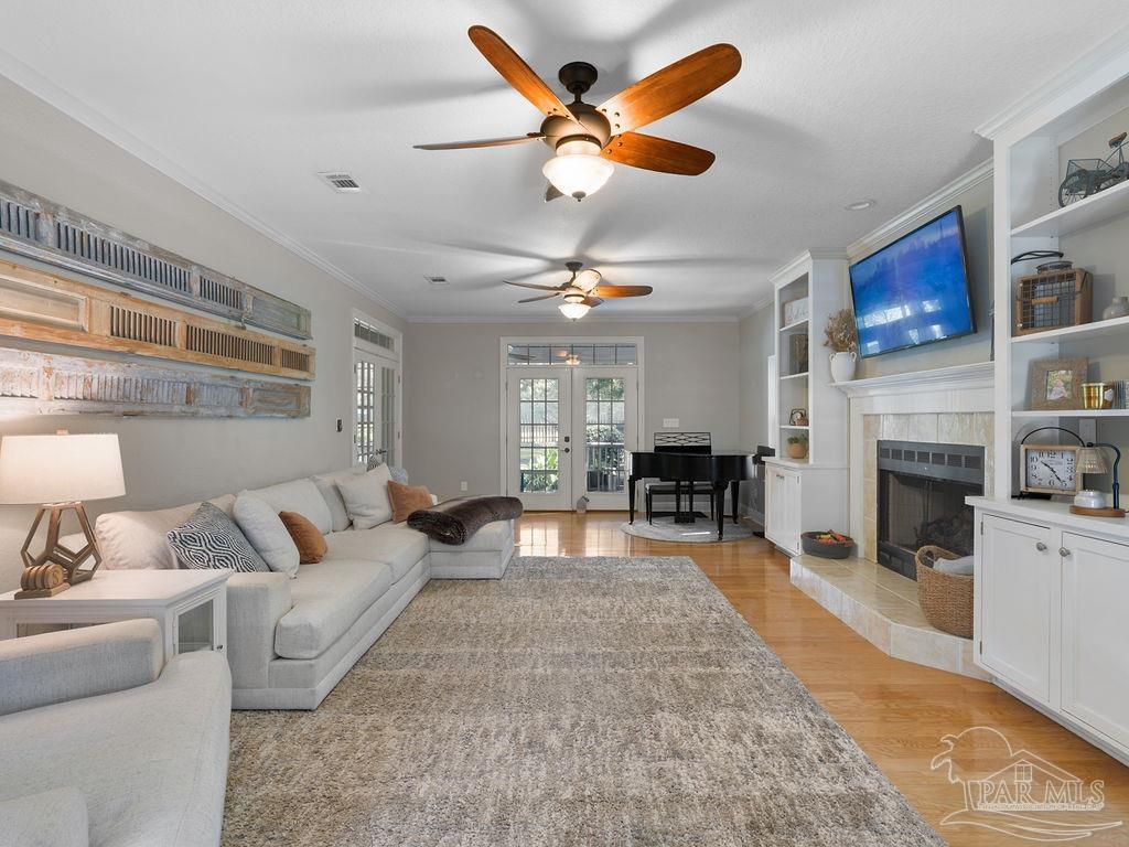 10152 Bittern Drive Pensacola, FL 32507 - Photo 10 of 45 a living room with furniture and a fireplace