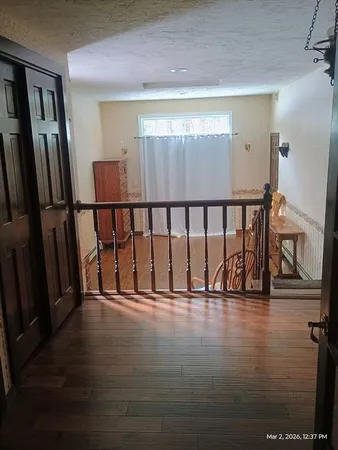 a view of entryway with wooden floor