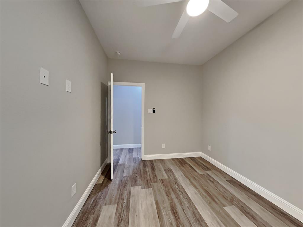 2512 Sharon Street Dallas, TX 75211 - Photo 11 of 17 a view of a room with wooden floor