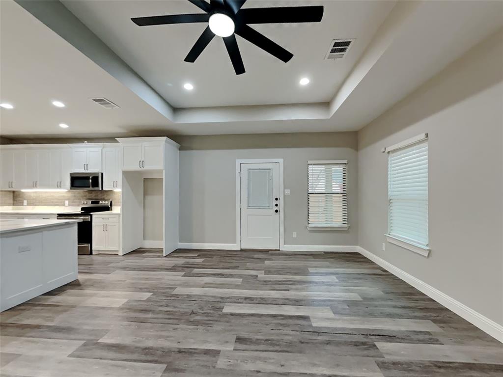 2512 Sharon Street Dallas, TX 75211 - Photo 2 of 17 a view of a kitchen with a sink and a refrigerator