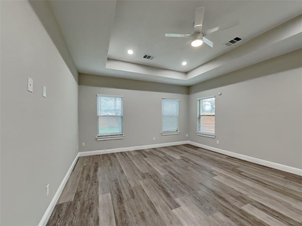 2512 Sharon Street Dallas, TX 75211 - Photo 8 of 17 wooden floor in an empty room with a window