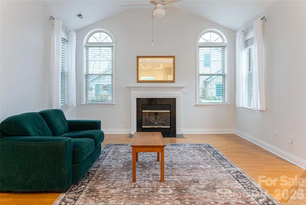 a living room with furniture and a rug