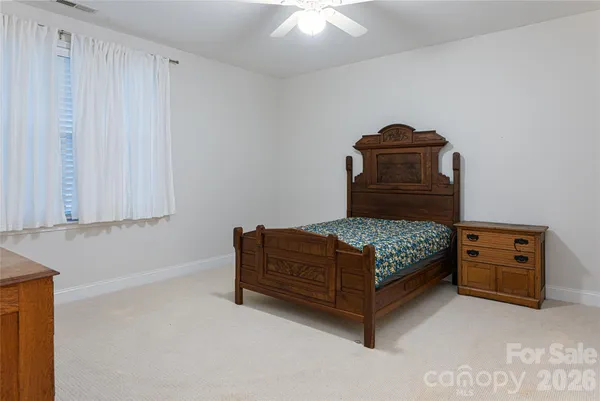 a bedroom with a bed and cabinets