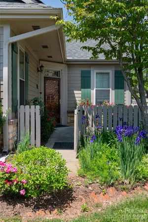 a front view of house and yard with seating space