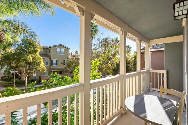 a view of a balcony with wooden floor