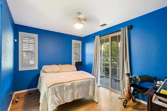 a bedroom with a bed and a desk