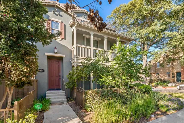 a view of a house with potted plants