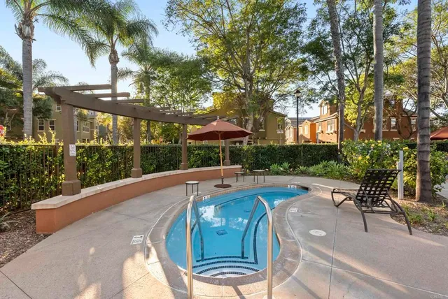 a view of a swimming pool with a patio
