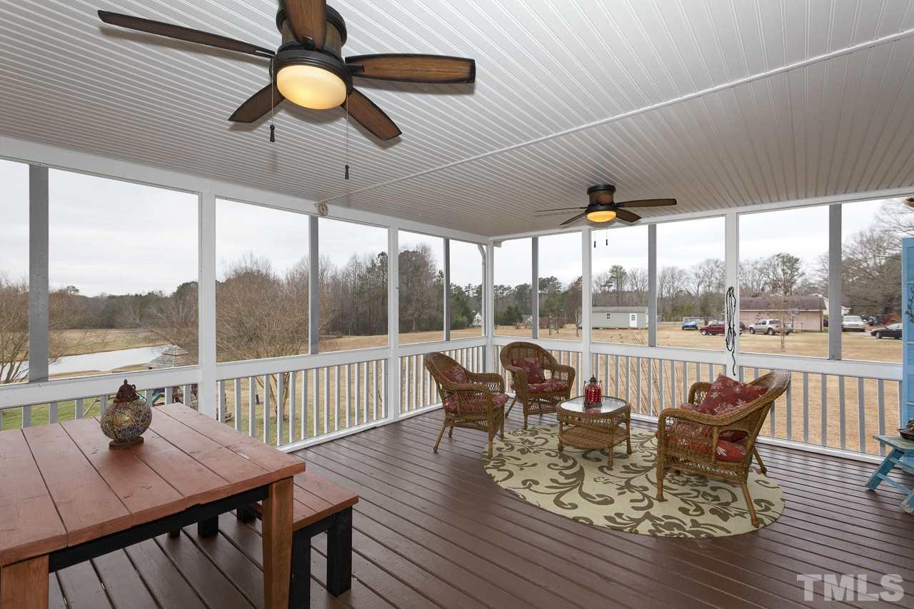 7850 James Austin Road Willow Spring, NC 27592 - Photo 20 of 25 a view of a dining room with furniture window and outside view