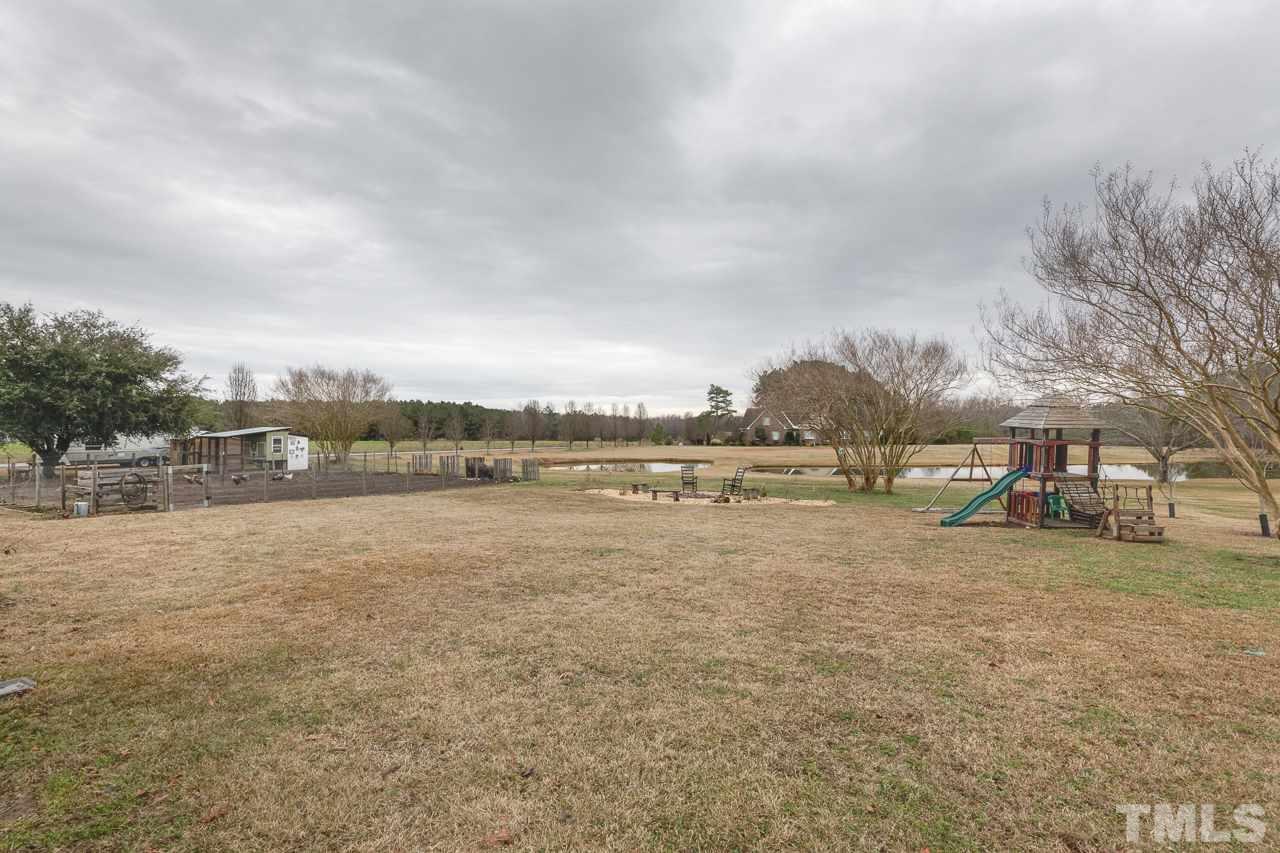 7850 James Austin Road Willow Spring, NC 27592 - Photo 23 of 25 a view of a lake with houses