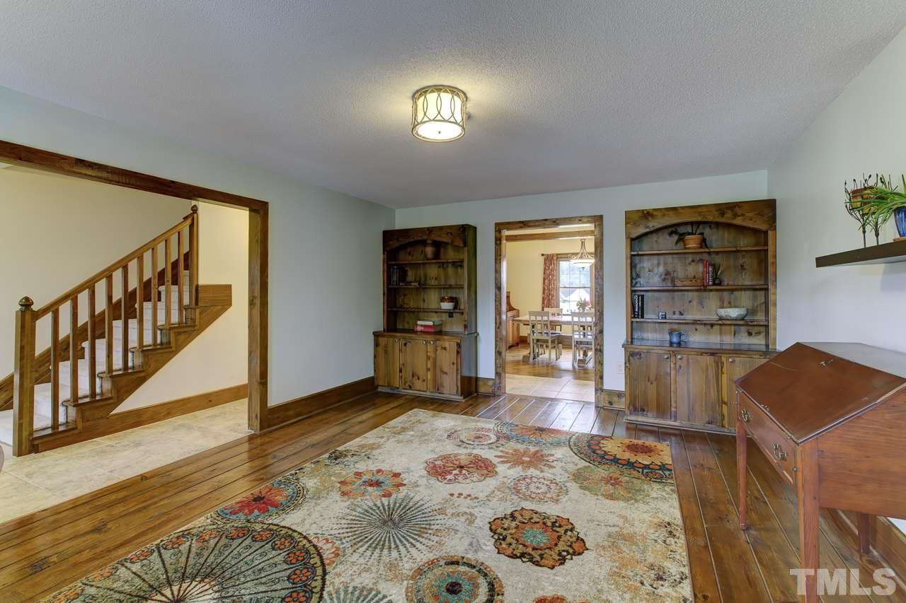 7850 James Austin Road Willow Spring, NC 27592 - Photo 4 of 25 a living room with furniture and a rug