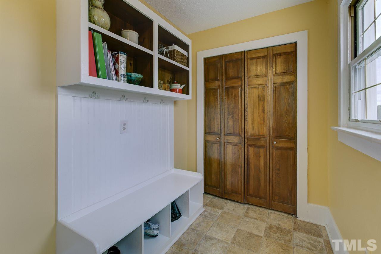 7850 James Austin Road Willow Spring, NC 27592 - Photo 10 of 25 a hallway with cabinets