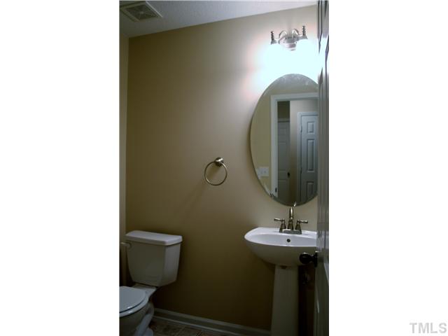 6009 Ladish Lane Raleigh, NC 27610 - Photo 10 of 21 New paint and flooring in the first floor bathroom.