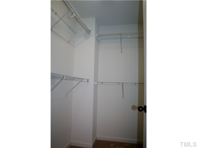 6009 Ladish Lane Raleigh, NC 27610 - Photo 14 of 21 Large master walkin closet for all your wardrobe.