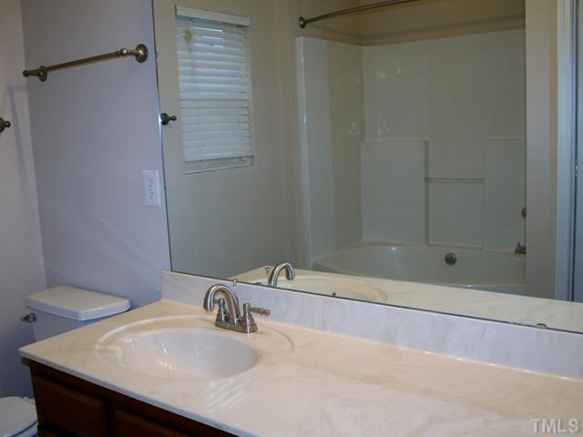 6009 Ladish Lane Raleigh, NC 27610 - Photo 15 of 21 Here is the private master bath with double wide vanity, large soaking tub, new paint and flooring.