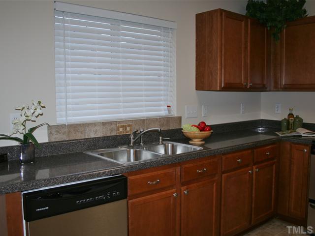 6009 Ladish Lane Raleigh, NC 27610 - Photo 8 of 21 beautiful counter tops, new appliances and lots of beautiful cabinets in your awesome kitchen.