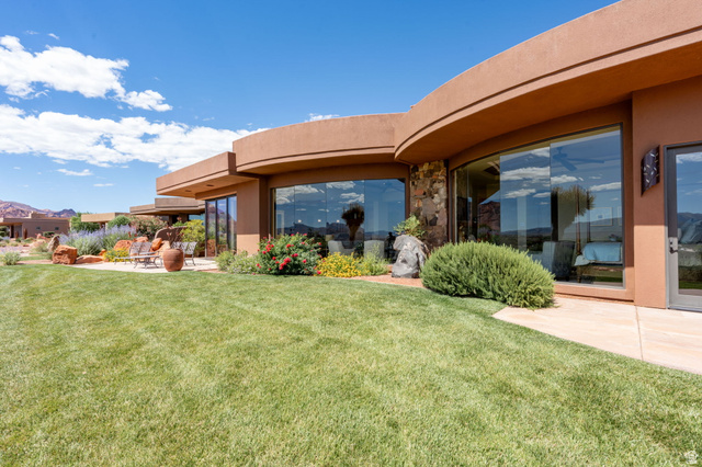 2331 West Entrada Trail, Unit 61 St. George, UT 84770 - Photo 57 of 69 Curved stucco exterior with expansive windows