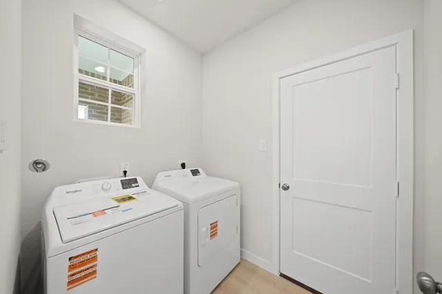 a utility room with dryer and washer